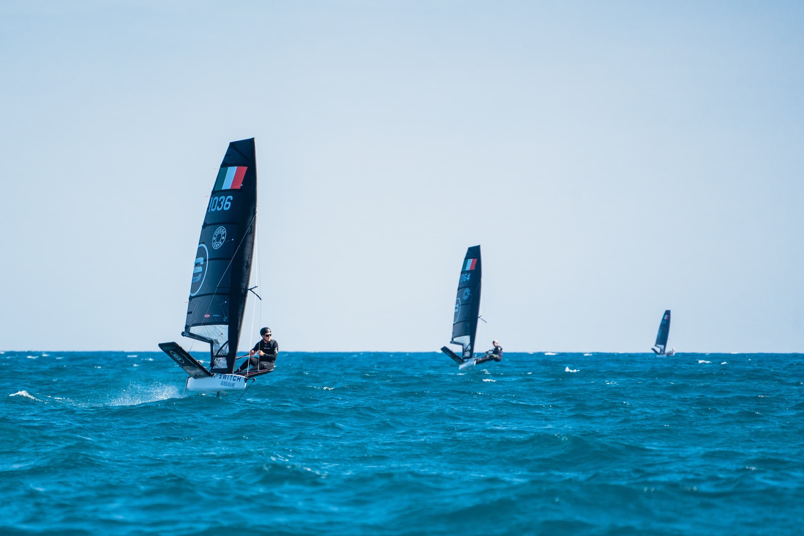 Competitive sailor foiling at speed in a high-performance single-handed dinghy.